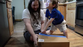 Toddler Helps Unbox Packages