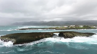 Facing the "hole in the rock" at Laie point