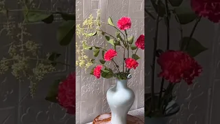 Flower arrangement with pink carnations