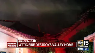 Firefighters rescue dog as house goes up in flames in west Phoenix