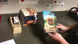 Covering a book with a clear book jacket