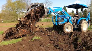 Popping a big stump with an LS Tractor Backhoe