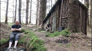 Building a shelter in the woods warm wood stove inside