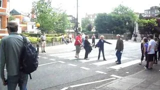 Tourists trying to take photos on Abbey Road