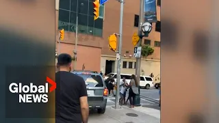 Video shows SUV driving on downtown Toronto sidewalk after alleged road rage incident