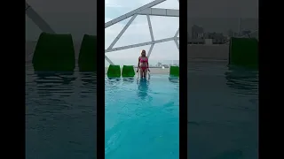 Enigmatic Impossible Sky High Infinite Pool Over Ocean W Pink Mini Bikini Girl Beautiful Short Video