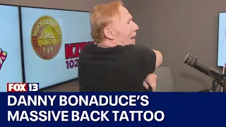 Danny Bonaduce shows off his Seattle skyline tattoo
