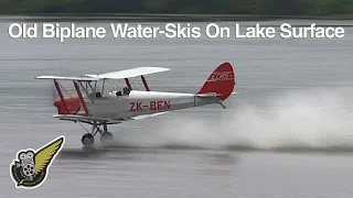 Tiger Moth biplane waterskiing on lake - like skimming stones