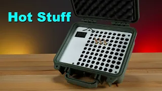 Heated ammo box for temperature controlled ammunition