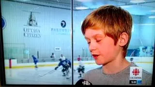 Clarke kids at Sens games... big Sens fans... TV interview