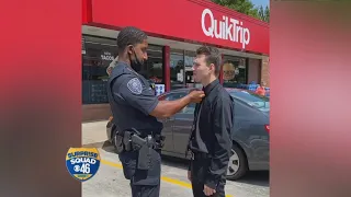 Police officer helps young man tie his tie receives a big surprise