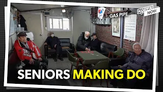 Elderly citizens take shelter from the winter cold at makeshift center
