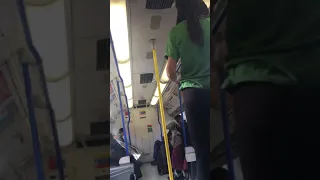 Jamaican stretching  inside London Train