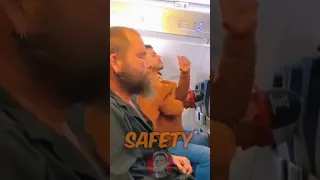 The intoxicated man lights a cigarette on a flight