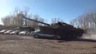 Tank crushes car