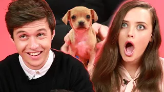 Katherine Langford And Nick Robinson From "Love, Simon" Play With Puppies