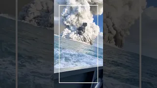 Volcanic eruption on the ocean.