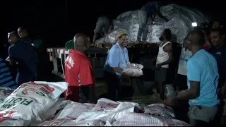 Fijian Attorney-General distributes food ration to the residents of Vunivau, Labasa after TC Yasa