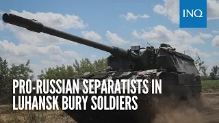 Pro-Russian separatists in Luhansk bury soldiers