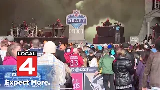 Football fans party in the streets during NFL draft in downtown Detroit