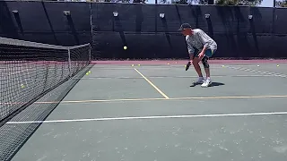 Pickleball Lessons.  Coach fires & smashes.  Working on proper technique on the return.