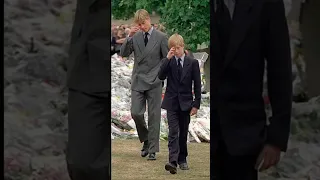 Prince  William and Harry along with family attending late  princess diana's funeral in 1997