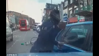 Road rage cyclist armed with a huge 'zombie knife' attacks motorist