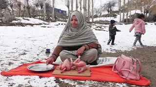 Cooking Crispy Chicken On Iron Grill In A snowy Day In Gilgit Baltistan