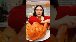 Girl Eats a King Crab