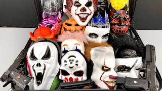 A Huge Bag Of Scary Masks, Halloween Masks, Toy Bead Throwing Guns And a Toy Desert Eagle Gun