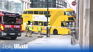 Double-decker bus smashes through pub window near Oxford Street in London