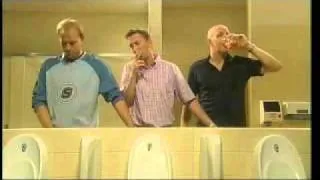 three guys helping each other piss one smoking one drinking