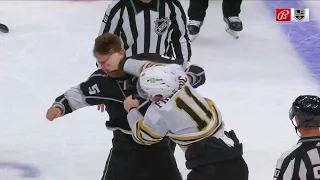Andreas Englund and Trent Frederic engage in a bout.