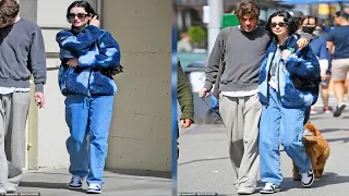 Meadow Walker cozies up to husband Louis Thornton-Allan who wraps arm around her as they walk dog in