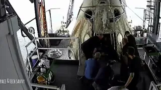 Nasa astronauts exit SpaceX Crew Dragon Capsule.