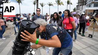 Eclipse spectators in Mexican resort town stake out their spots ahead of solar phenomenon