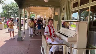 Grayson on Piano at Cassey’s Magic Kingdom Disney World