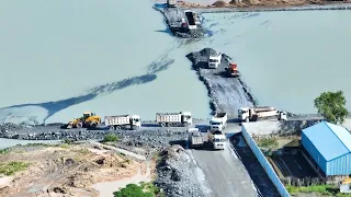 Build a road across the lake Power Machane work dump truck  By Wheel Loader Push Stones into Water