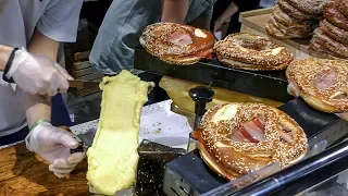 Huge Pretzel with Raclette Melted Cheese on Ham. Italy Street Food