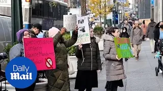 Covid-19 protests: Antivax protesters stand outside Pfizer HQ in New York