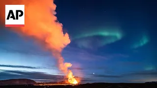 Timelapse shows Northern Lights shinning over erupting Iceland volcano
