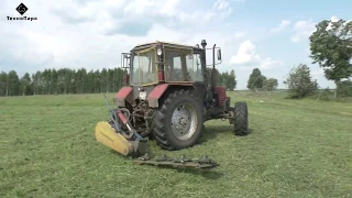 Belarus TTR-401M mowing pasture with rotary mower