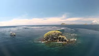 a drone flying over Komodo Resort & Diving Club