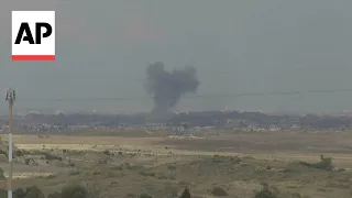 Smoke rises over the Gaza skyline as Israel continues its military operations