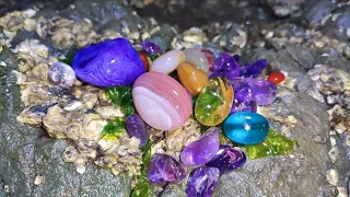 Colorful and transparent pebbles are all over the beach, an abandoned gem island in the PacificOcean