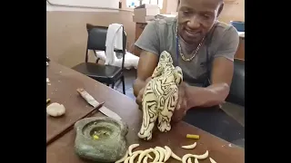 Swazi Candles maker, creating an elephant candle