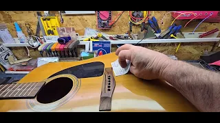 Guitar repair. Diagnosing a Fender "DG-3" acoustic with cracked bridge and loose brace.2024