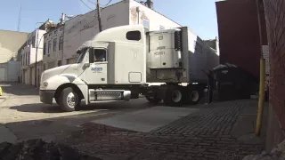 Trucker backing up a 53ft trailer to a dock in a tight alley!