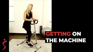 Getting on the No.077 Row-N-Ride Squat Assist Machine