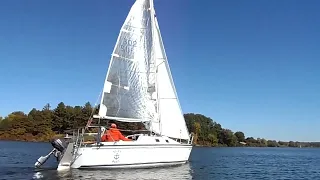 Sailboat chasing with power canoe